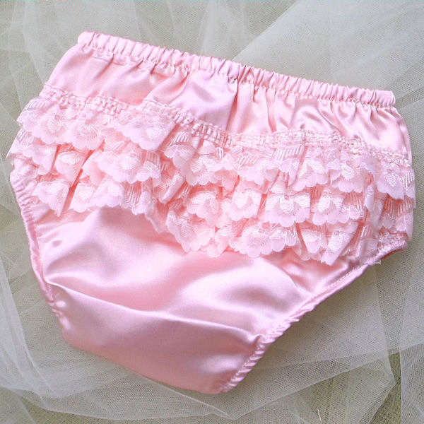 Baby's frilly knickers in ivory, white or pink in sizes from birth